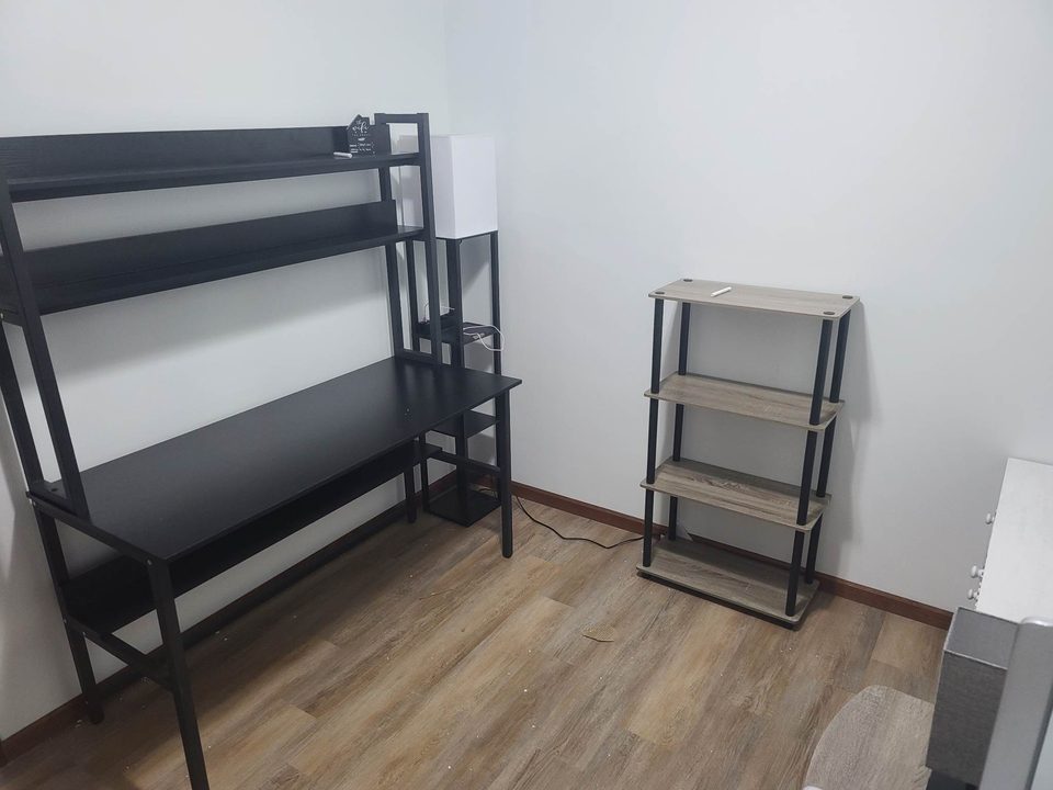Office with a loft-style desk and shelving